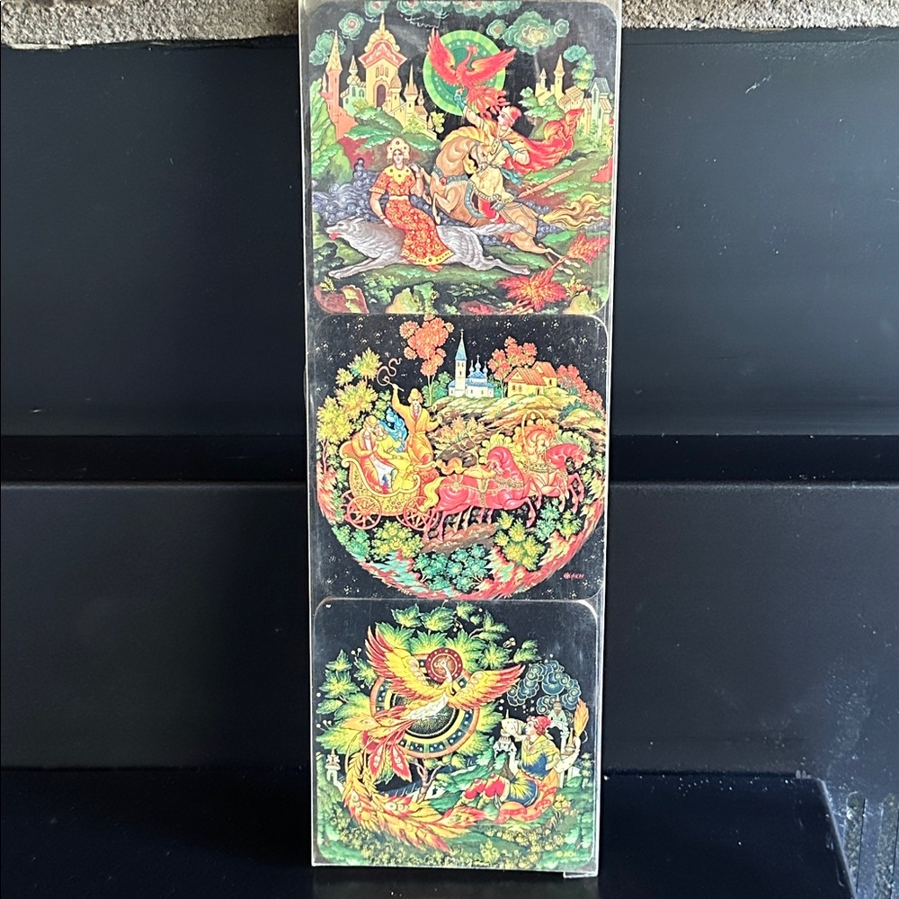 Russian Palekh lacquer coasters feat miniature paintings of fairy tale scenes